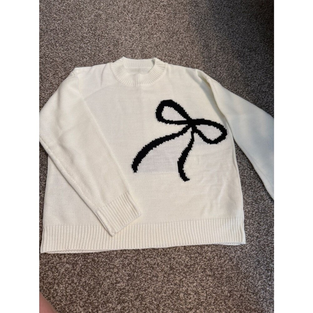 Classic Cream Sweater with Black Bow Accent